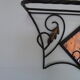 Wrought iron wall holder with top support and built-in mirror