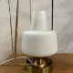 Table lamp in gold metal and opaline.