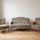 Louis XV style living room set with a sofa and 2 armchairs in cherry wood and fabric.