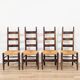 Set of 4 brutalist chairs in carved wood and straw – Circa 1940
