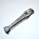 Rocaille sugar tongs in silver metal with lion claw medallion