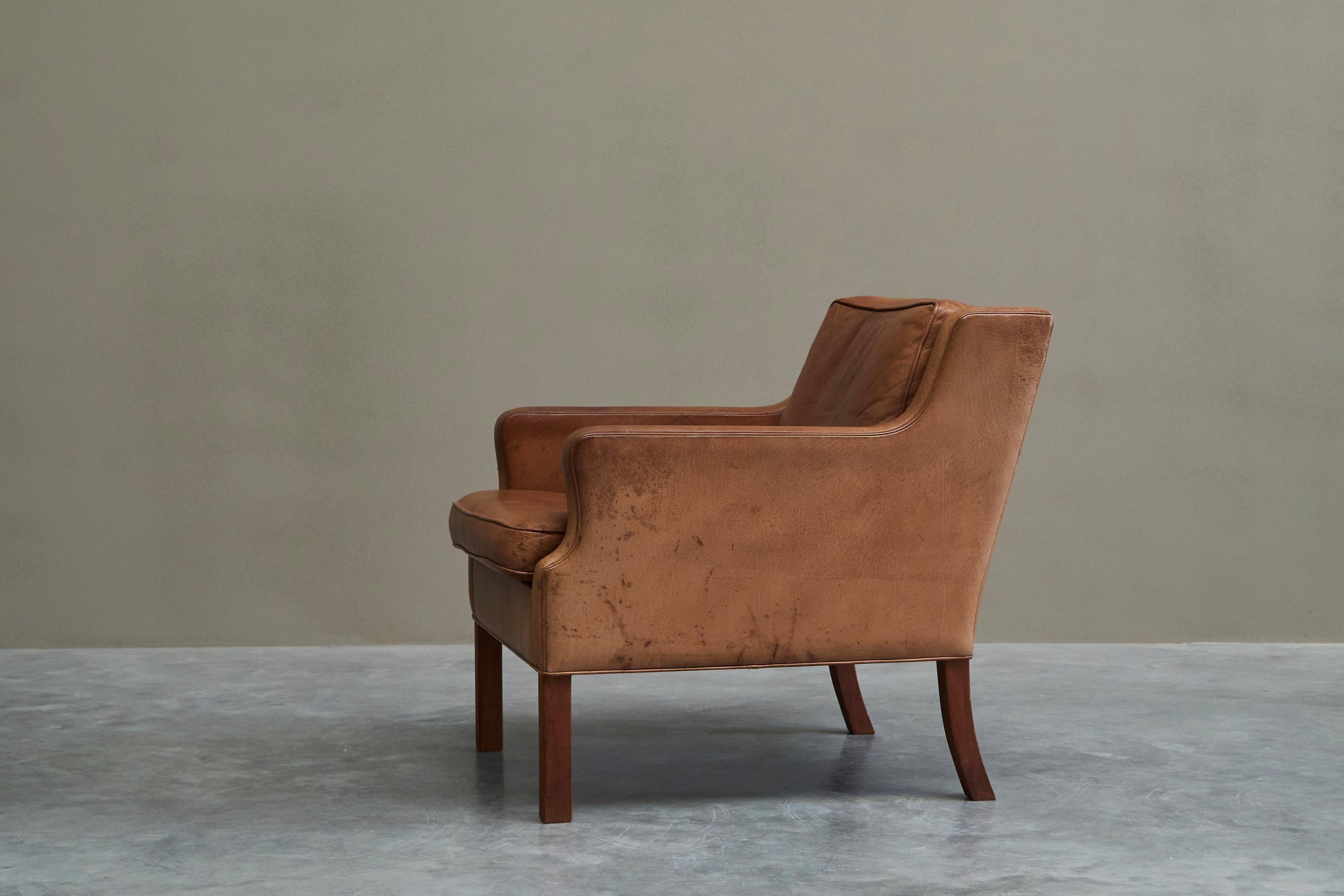 1970s patinated leather Scandinavian lounge chair