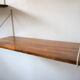 Modular wall shelves in exotic wood