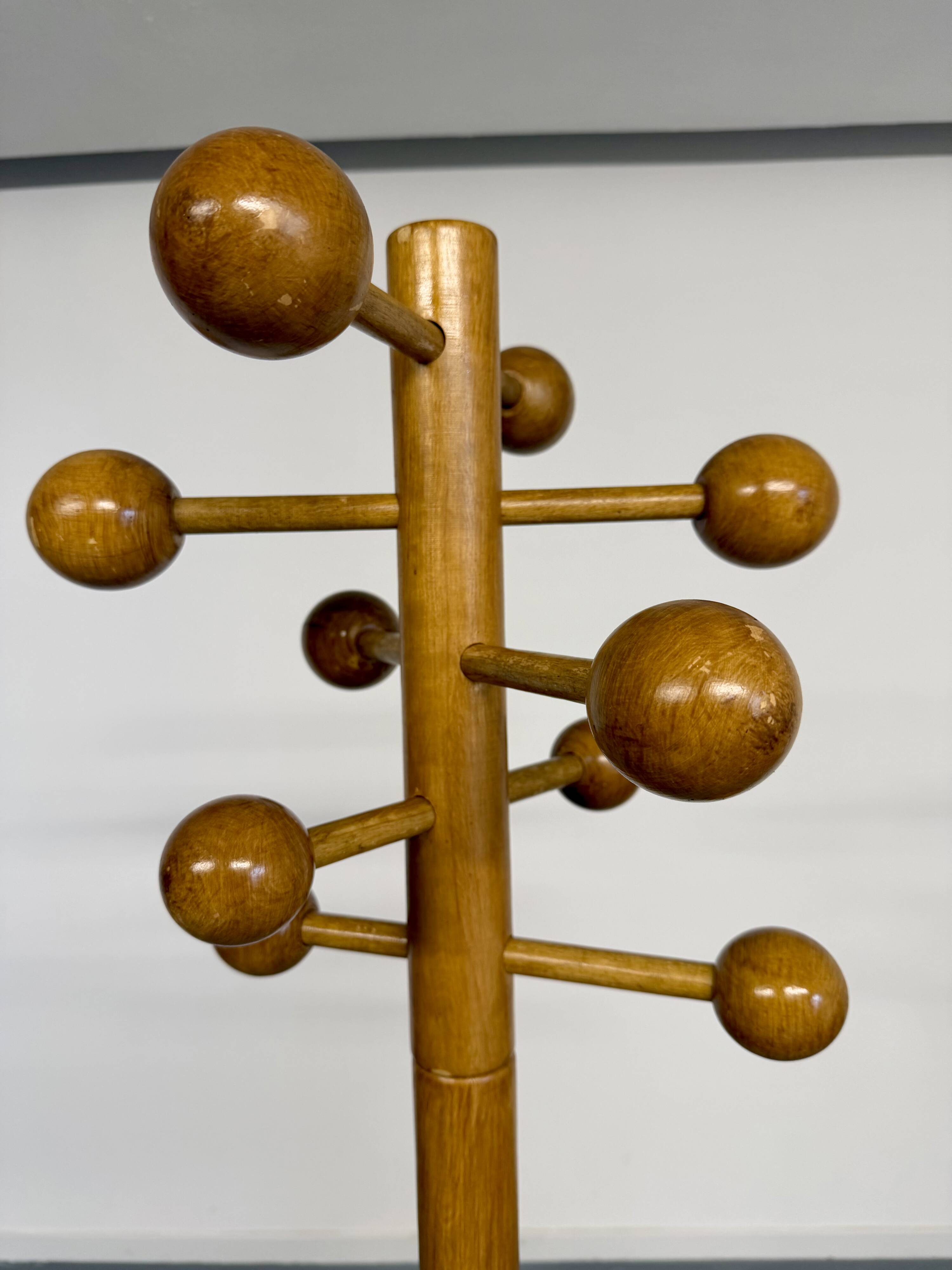 Vintage wooden coat stand with modernist design from the 1970s.