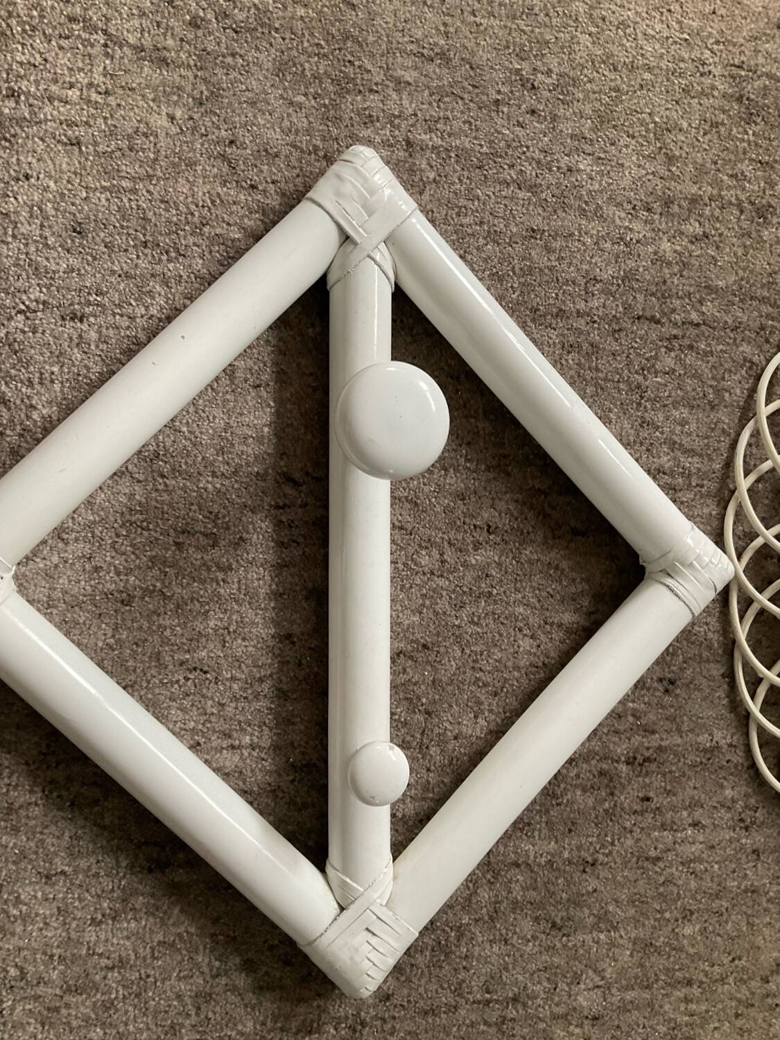 Rattan entrance set with mirror and 2 coat hooks.