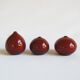 Trio of red miniature ceramics by Antonio Lampecco