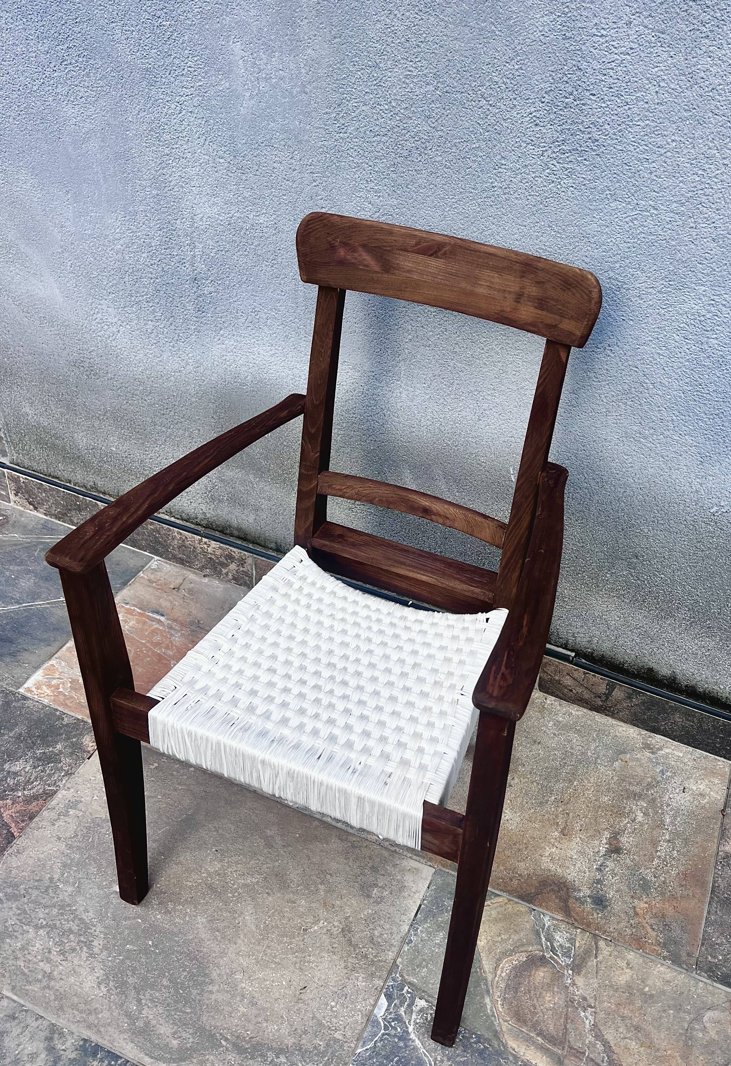 Scandinavian chair in wood and woven natural fibre.