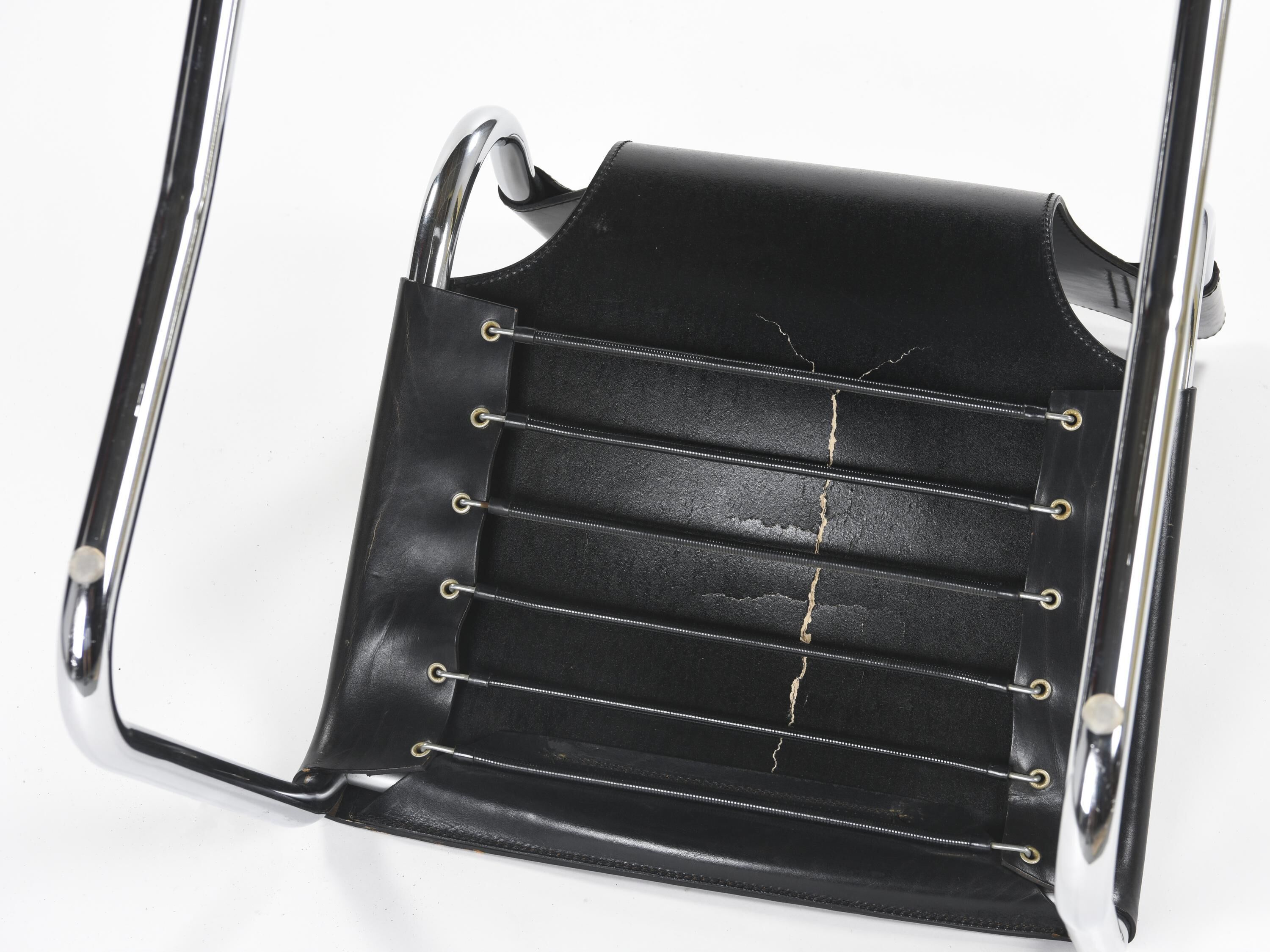 Black leather chairs by Carlo Bartoli