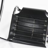 Black leather chairs by Carlo Bartoli