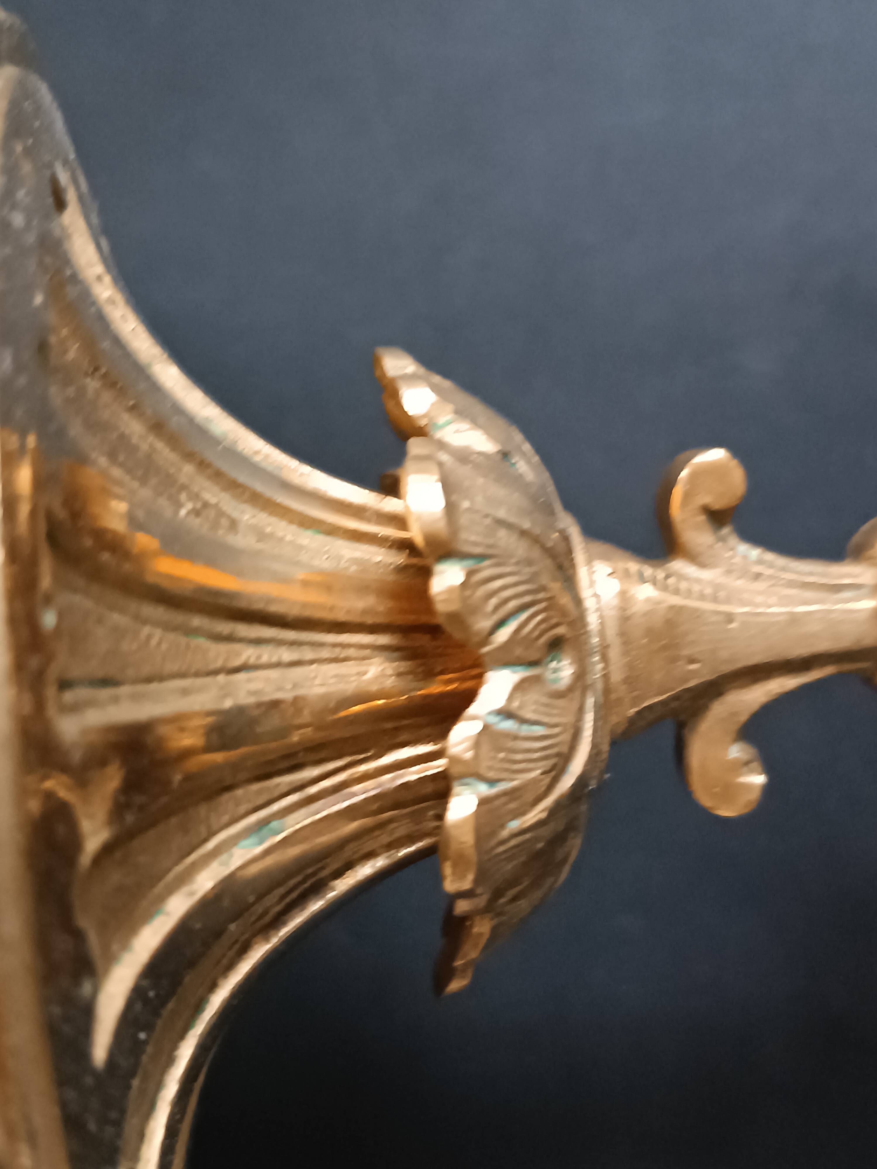 Antique three-light openwork brass church candelabrum.