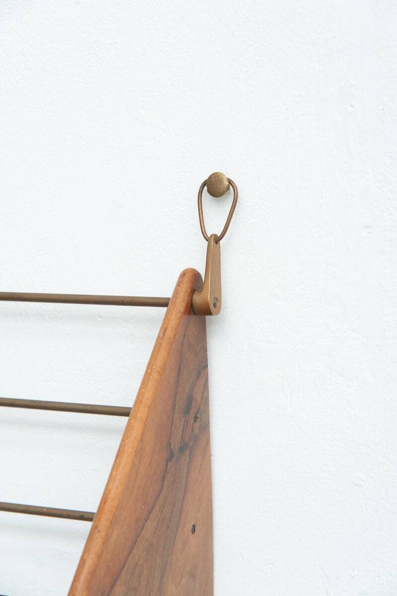 Wall-mounted walnut bookshelf by Carl Auböck, 1950s