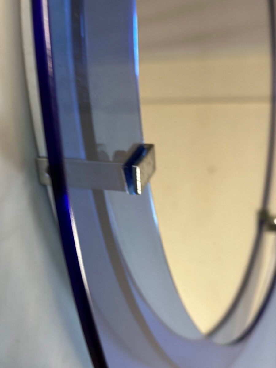Mirror framed by a blue glass circle, italy circa 1950