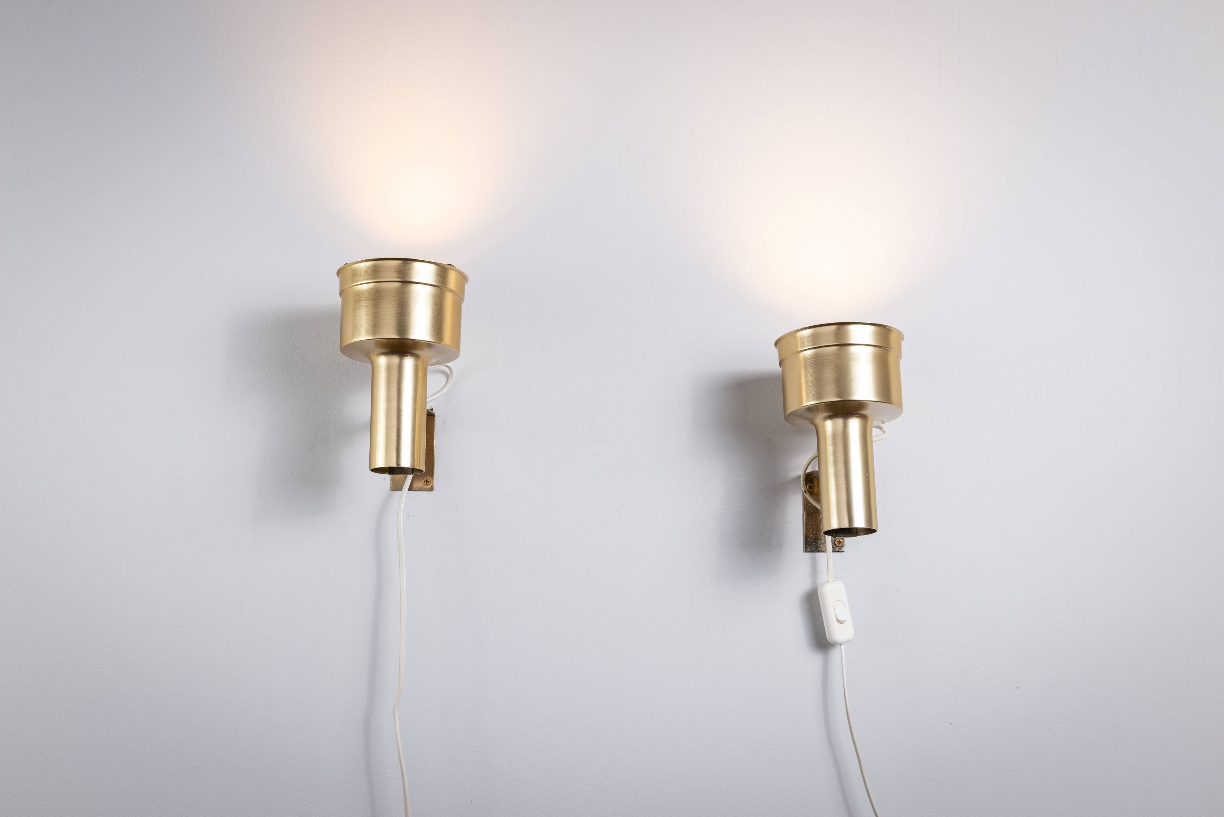 Pair of adjustable wall lamps designed by Per Sundstedt for Kosta Lampan