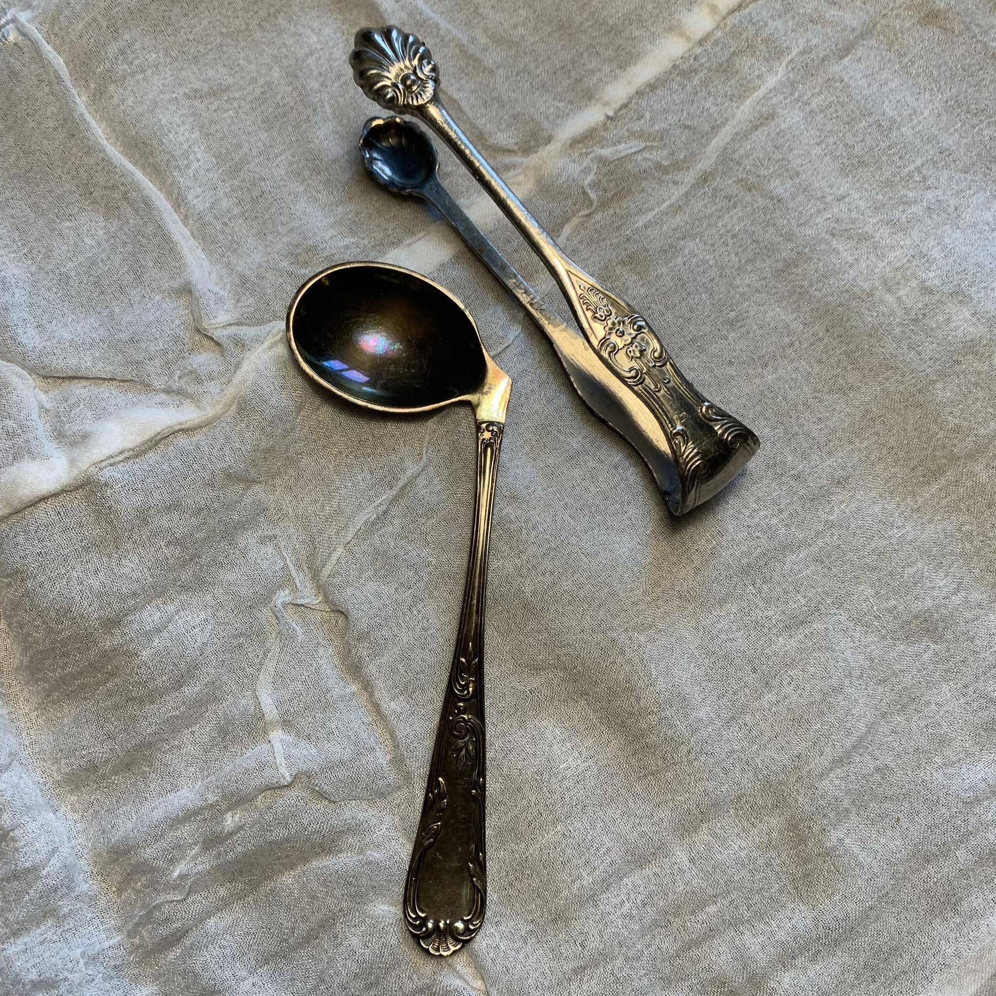 Set of a baby spoon and a sugar tongs