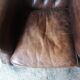 Fauteuil chesterfield à oreille cuir