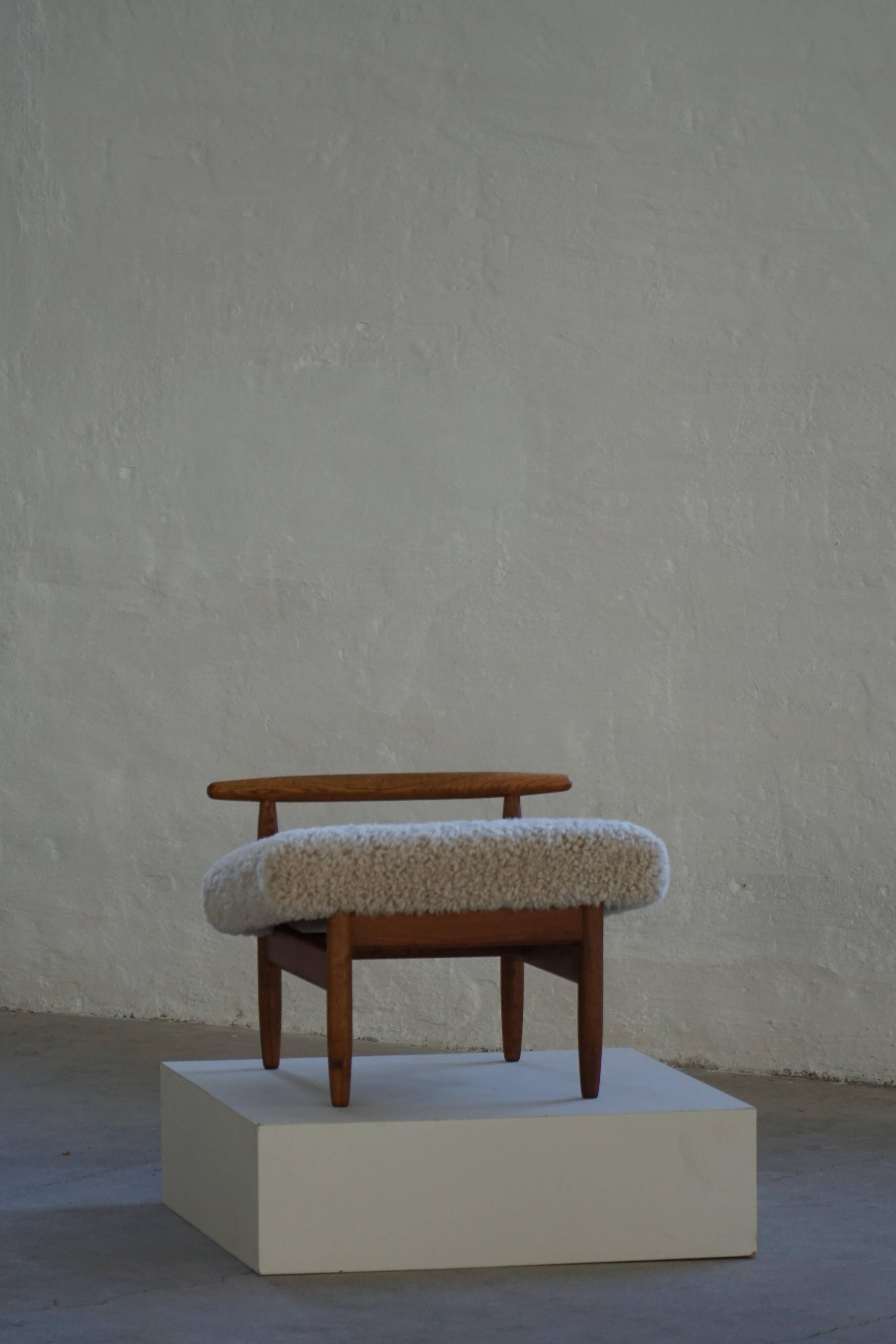 Eivind A. Johansen, oak footrest with light lambswool padding for FDB Møbler