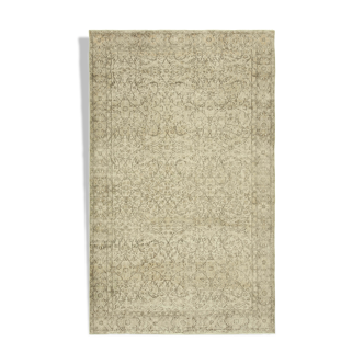 Handwoven vintage anatolian beige carpet 188 cm x 296 cm