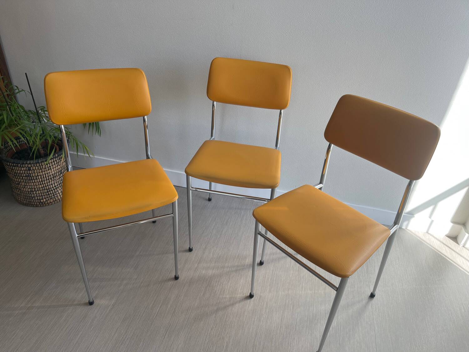LM vintage chrome and orange/mustard yellow faux leather chairs