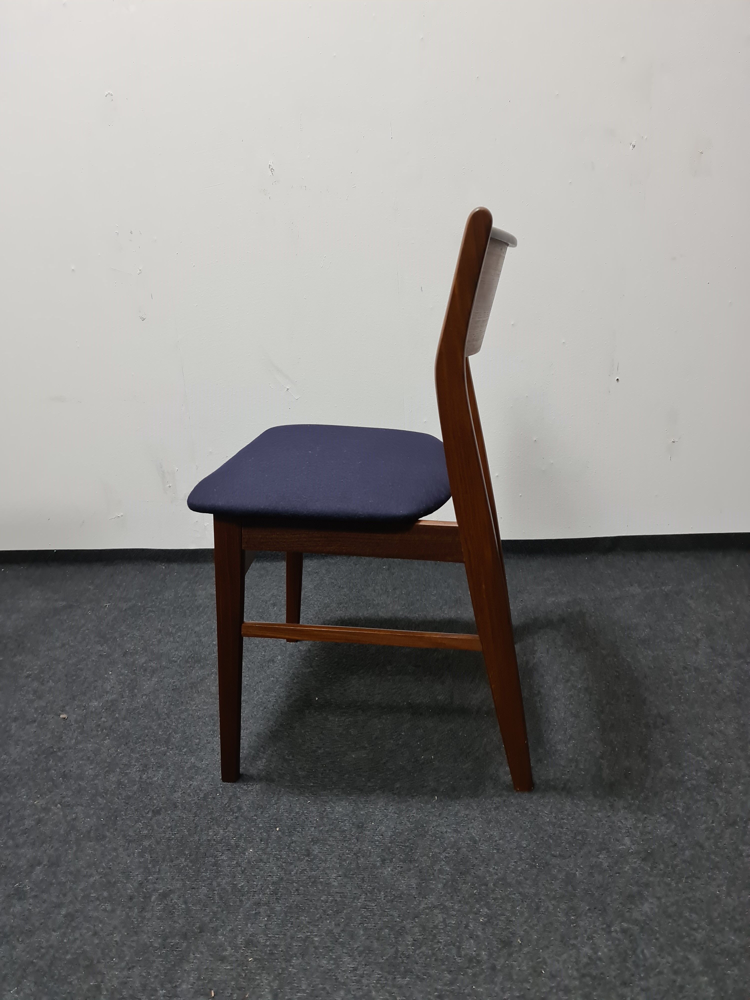 A pair of vintage teak dinning chairs