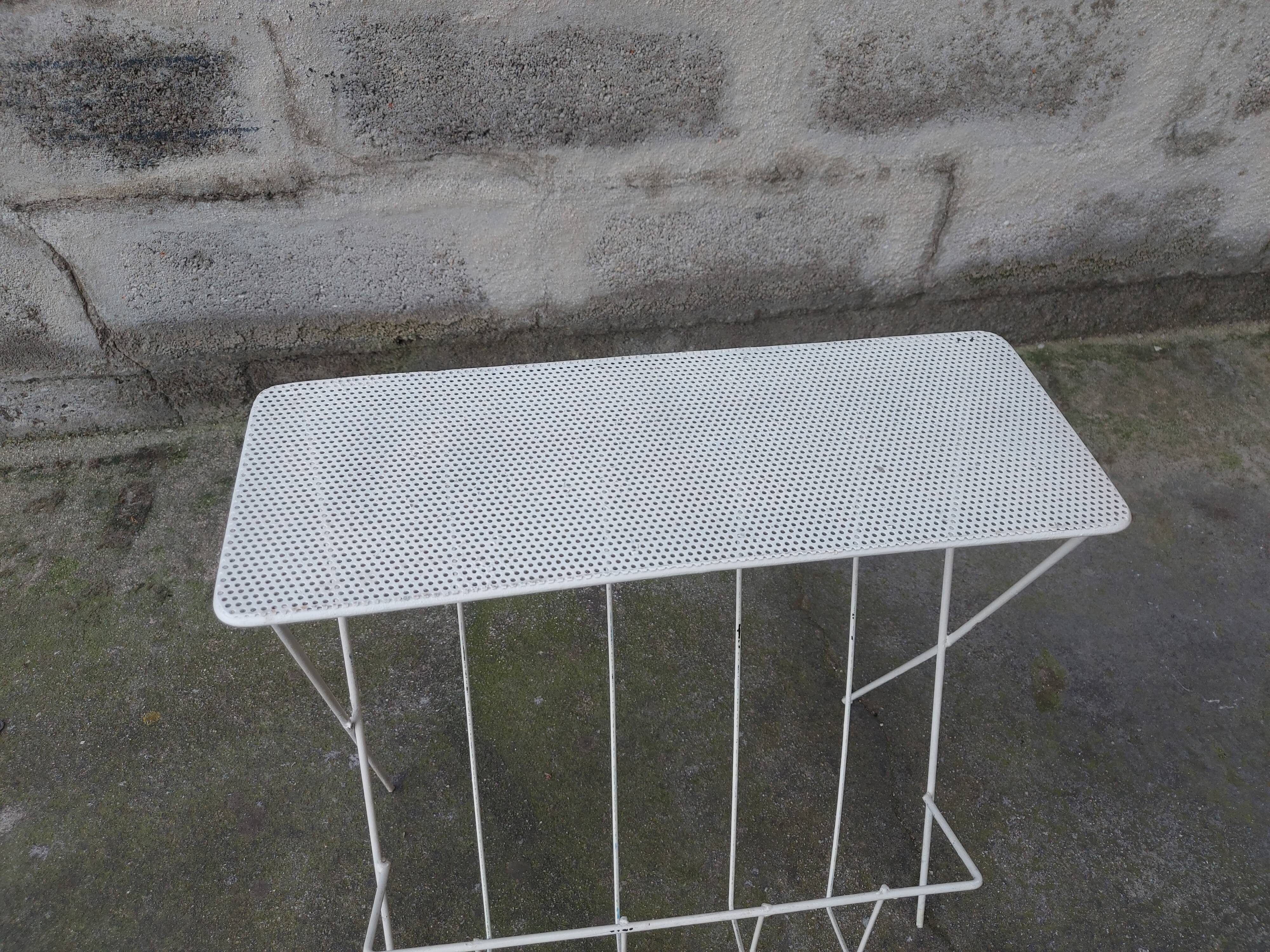 Vintage magazine holder in perforated metal