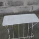 Vintage magazine holder in perforated metal