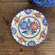 Henriot Quimper dessert plates, hand-painted earthenware.