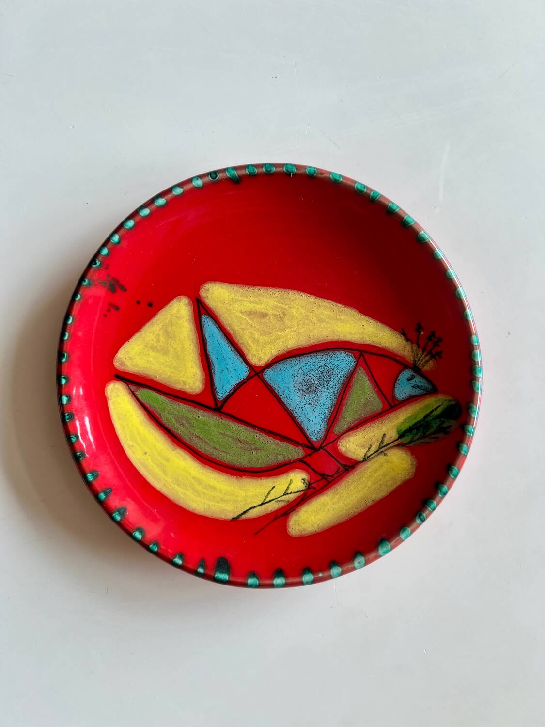 Red plate with abstract decoration, Atelier Cerenne Vallauris – 1950s