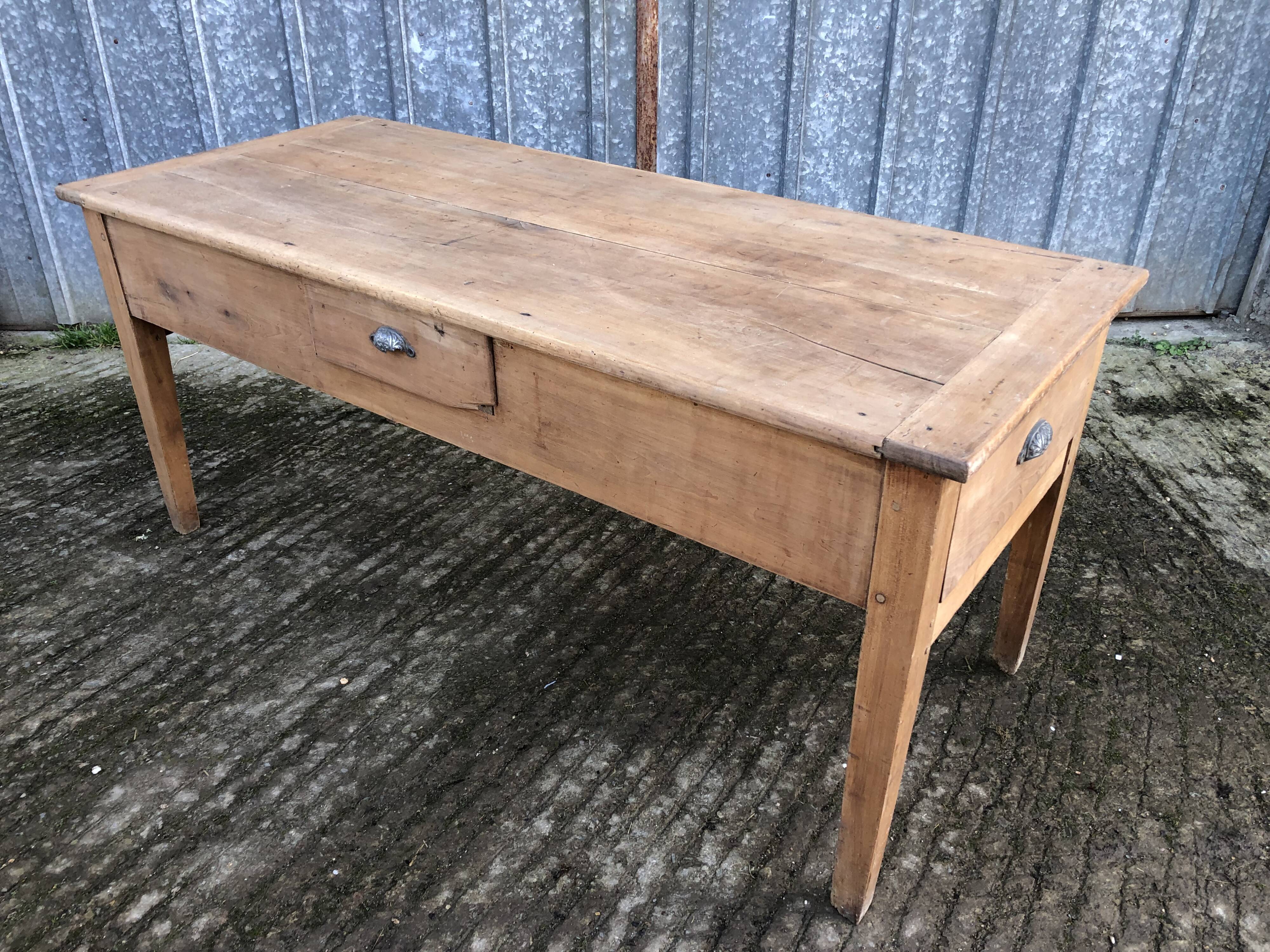 Antique solid cherry farmhouse table with 3 drawers and 1 pull out.