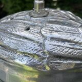 Old vintage lamp representing a duck in silver metal with wooden base
