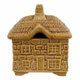 Devonway jam pot in the shape of a cottage with a thatched roof.