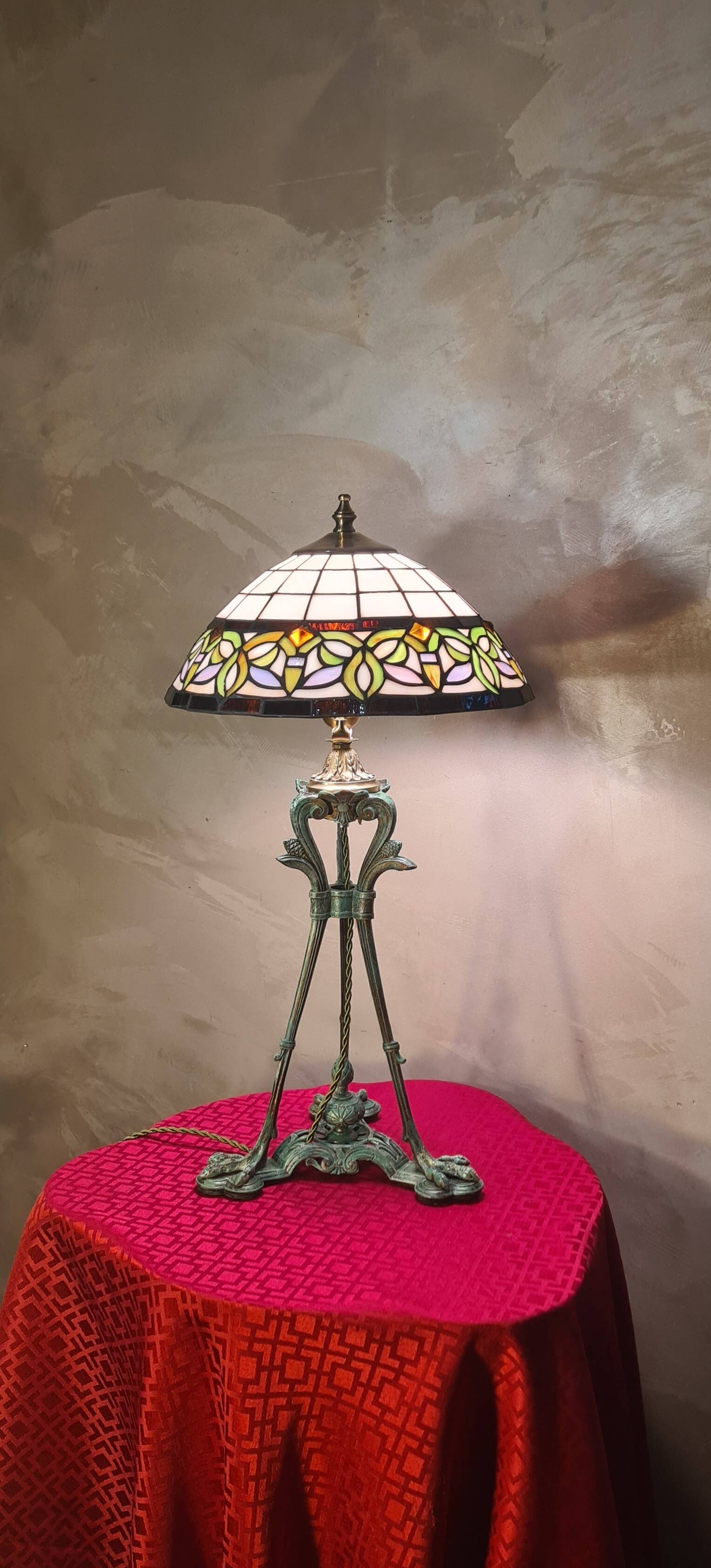 Antique patinated bronze regulator lamp with Tiffany glass shade in very good condition