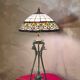 Antique patinated bronze regulator lamp with Tiffany glass shade in very good condition