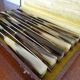12 old Art Deco horn and stainless steel knives in case