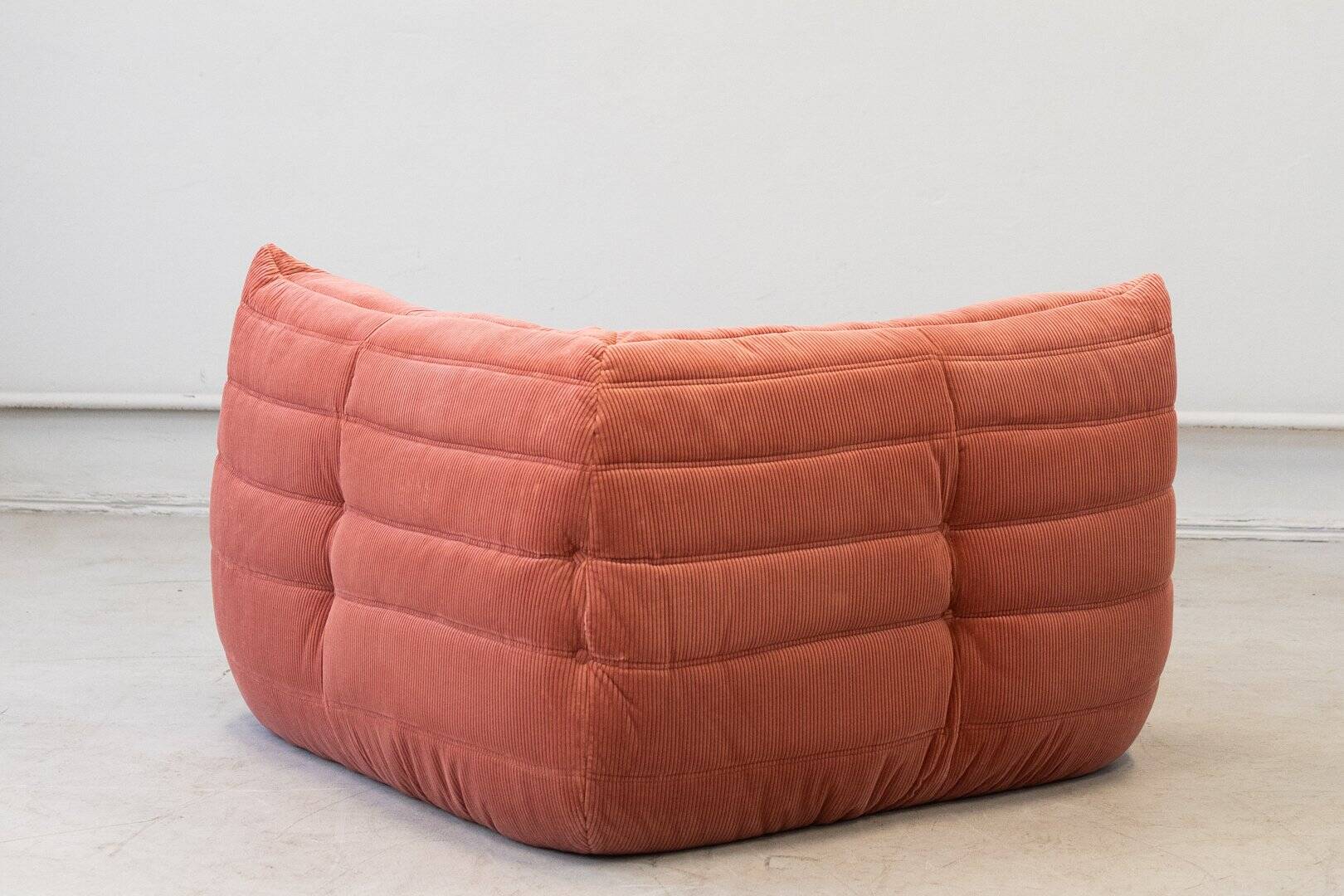Coral corduroy Togo corner chair by Michel Ducaroy for Ligne Roset
