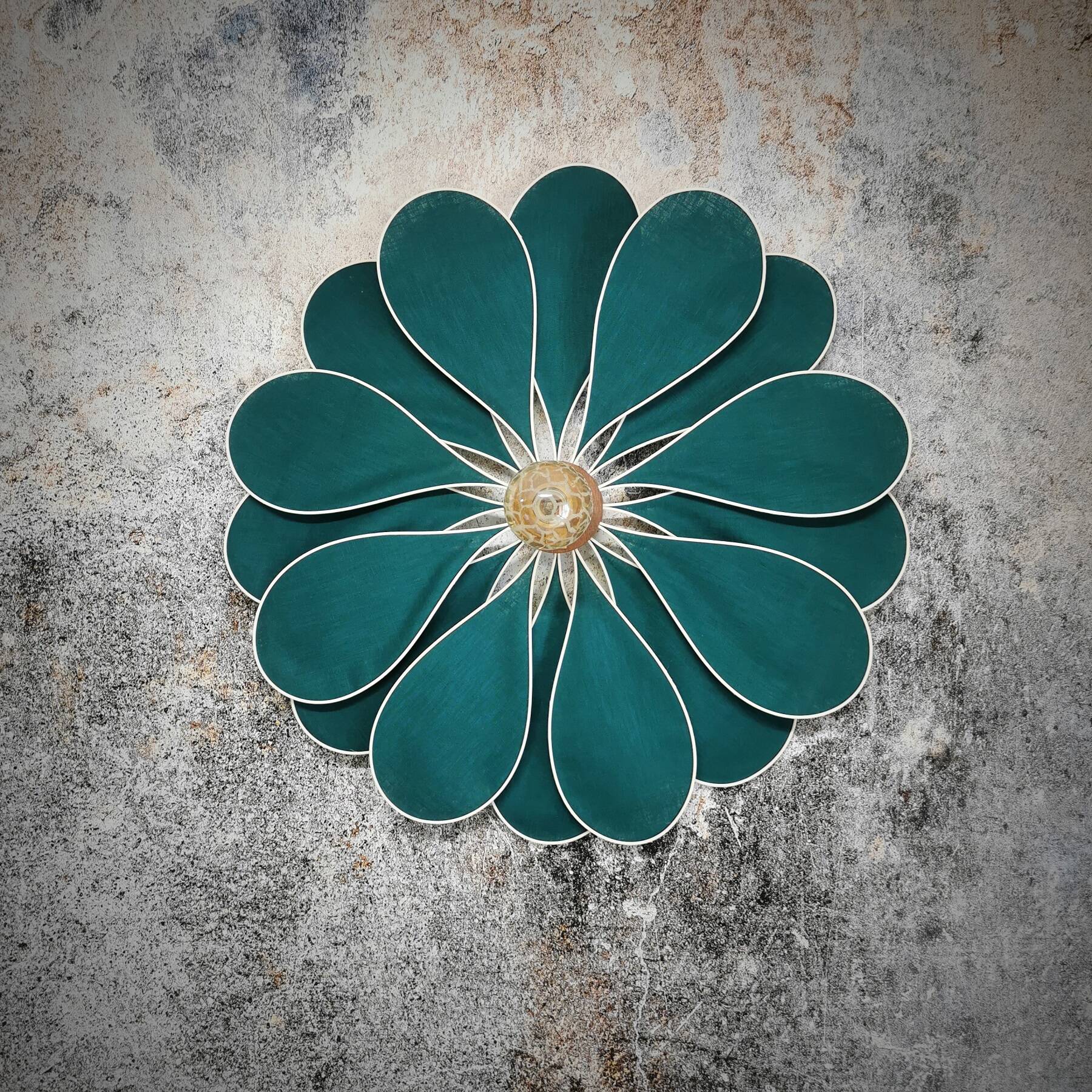 Emerald green rattan and linen flower wall light with 16 petals