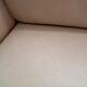 Beige leather sofa with solid wood frame