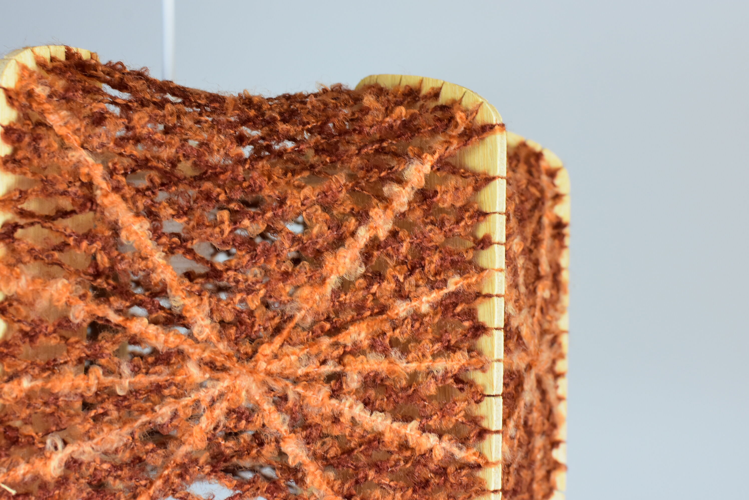 Brown wire and wood pendant light.