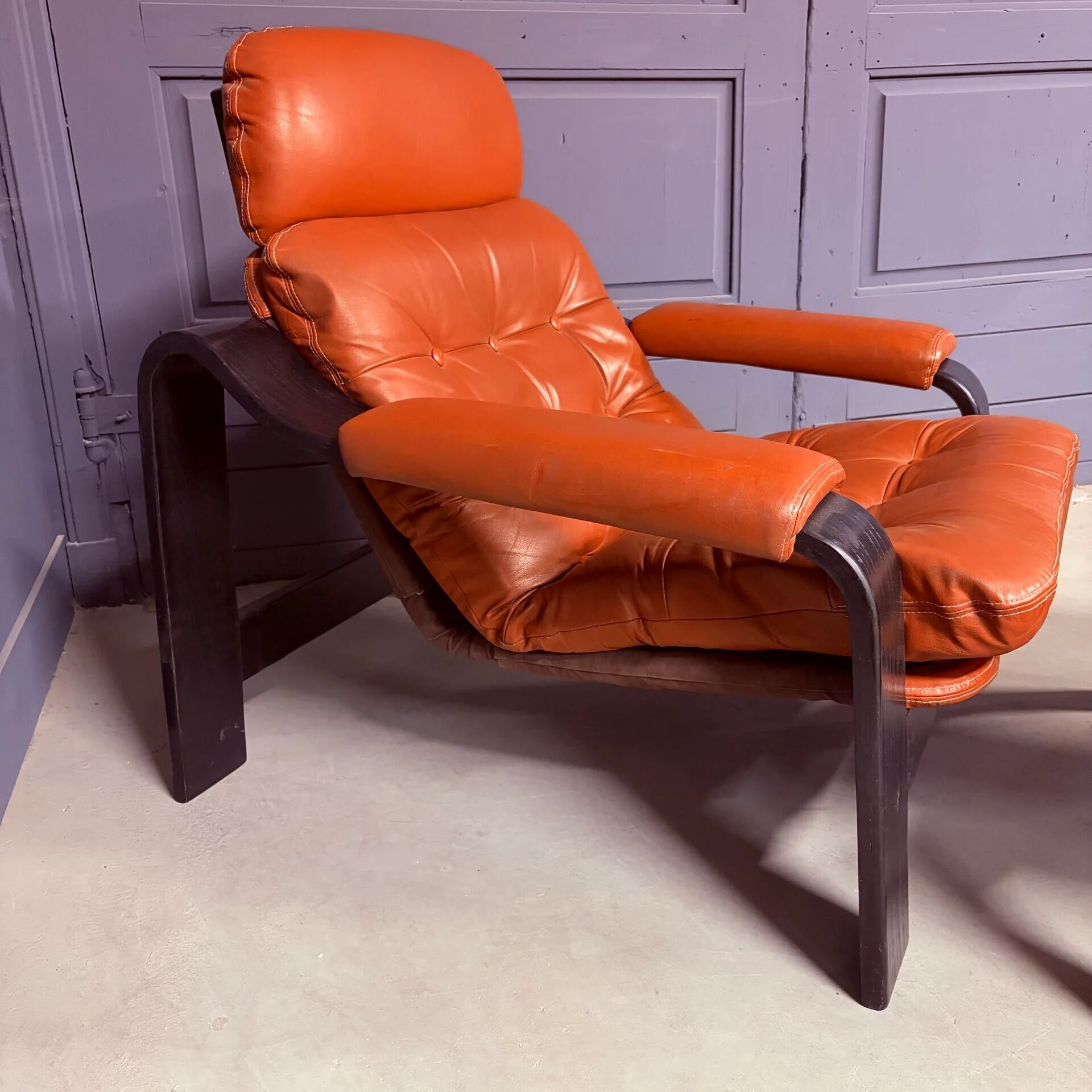 Vintage 1970s armchair with ottoman, leather and wood