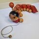 Vintage pulling toy, "centipede", 82 cm, made in Switzerland