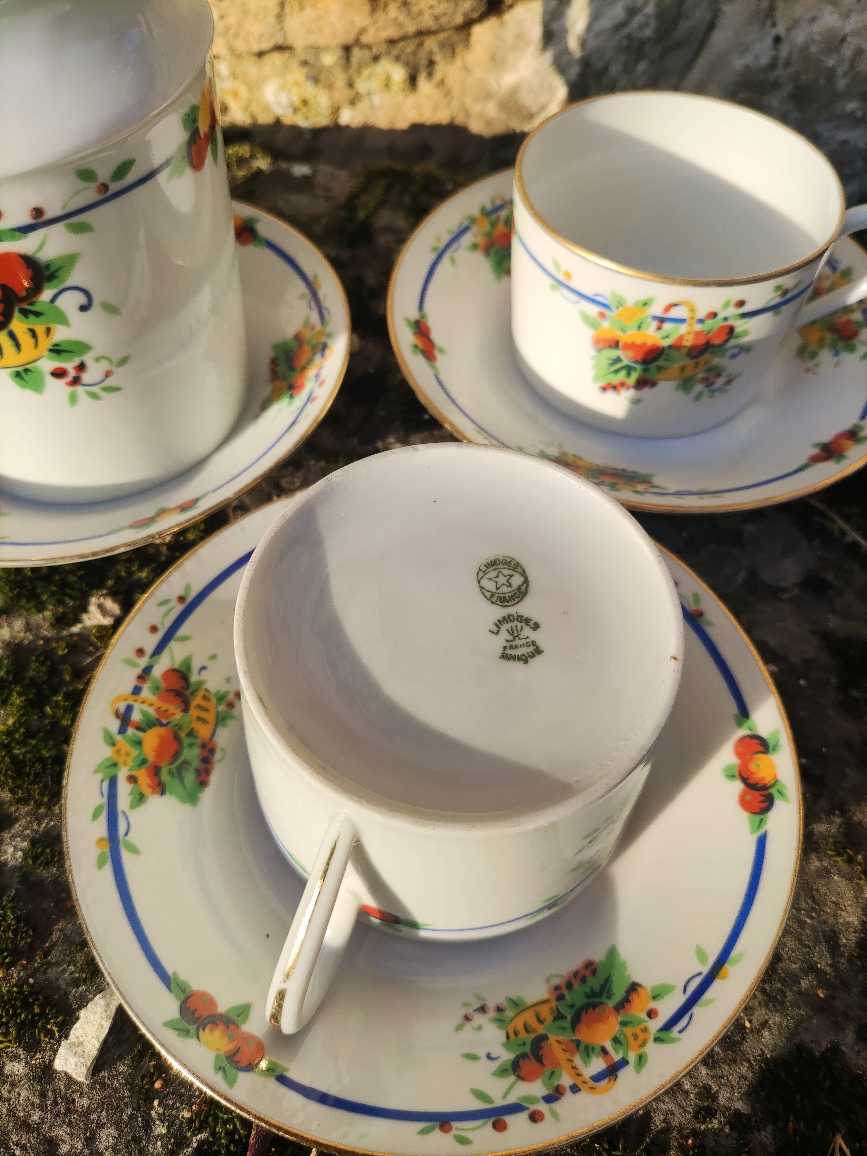 10 tea cups and creamer in Limoges porcelain