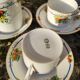 10 tea cups and creamer in Limoges porcelain