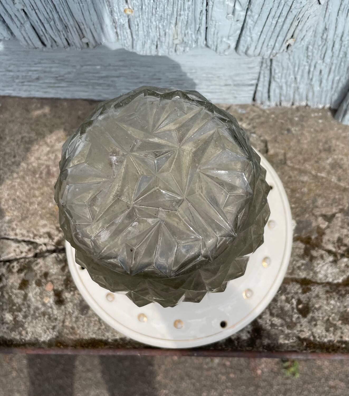 Art Deco ceiling light with a porcelain base.