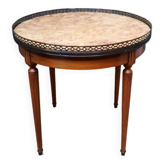 Circular coffee table with marble top