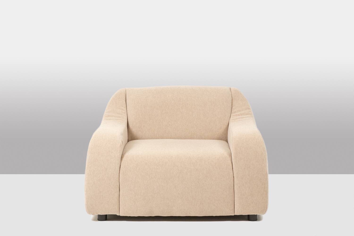 A pair of large and comfortable beige fabric armchairs. Contemporary.