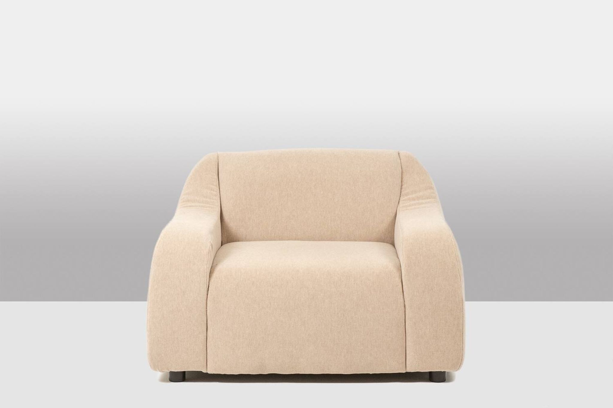 A pair of large and comfortable beige fabric armchairs. Contemporary.