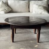Coffee table, round antique Indonesian teak table with straight legs.