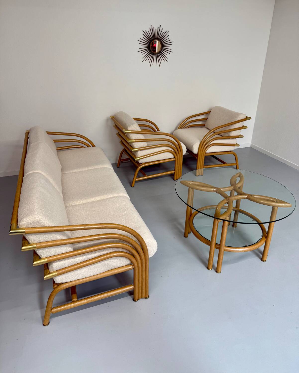 Complete living room with rattan sofa and white bouclette, brass finish, 80's design