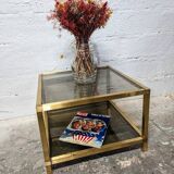 Table basse en métal doré et verre fumé