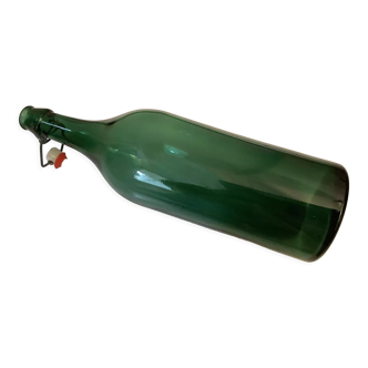 Xxl vintage bottle in green glass