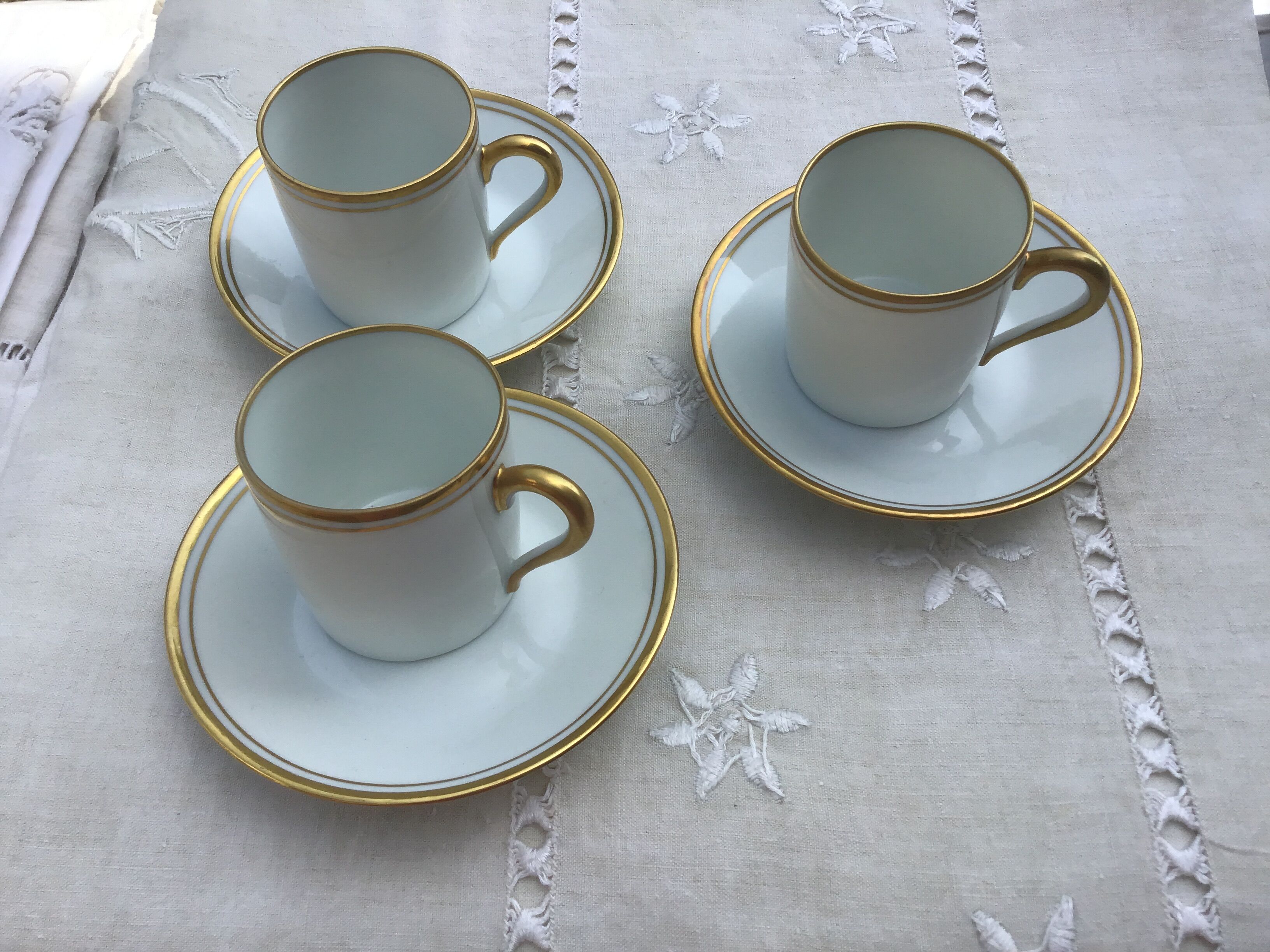 3 cups and their limoges porcelain undercup